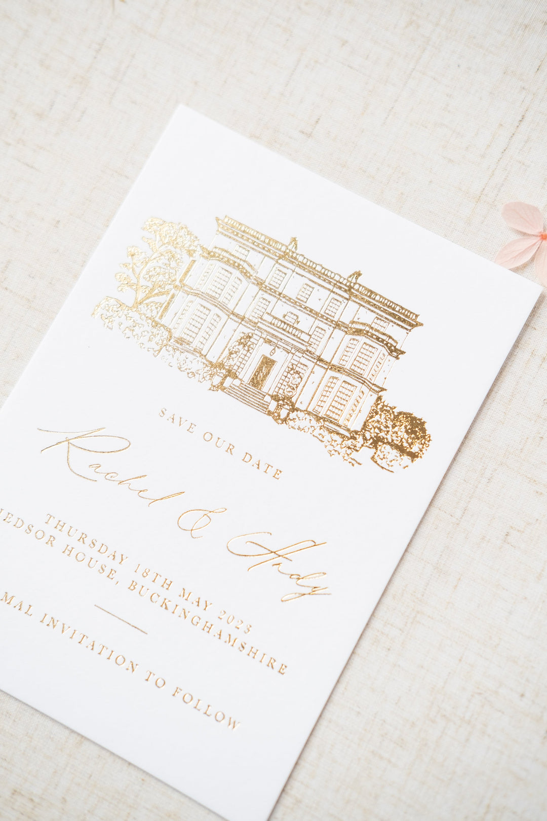 luxury gold foil invitation featuring a venue illustration