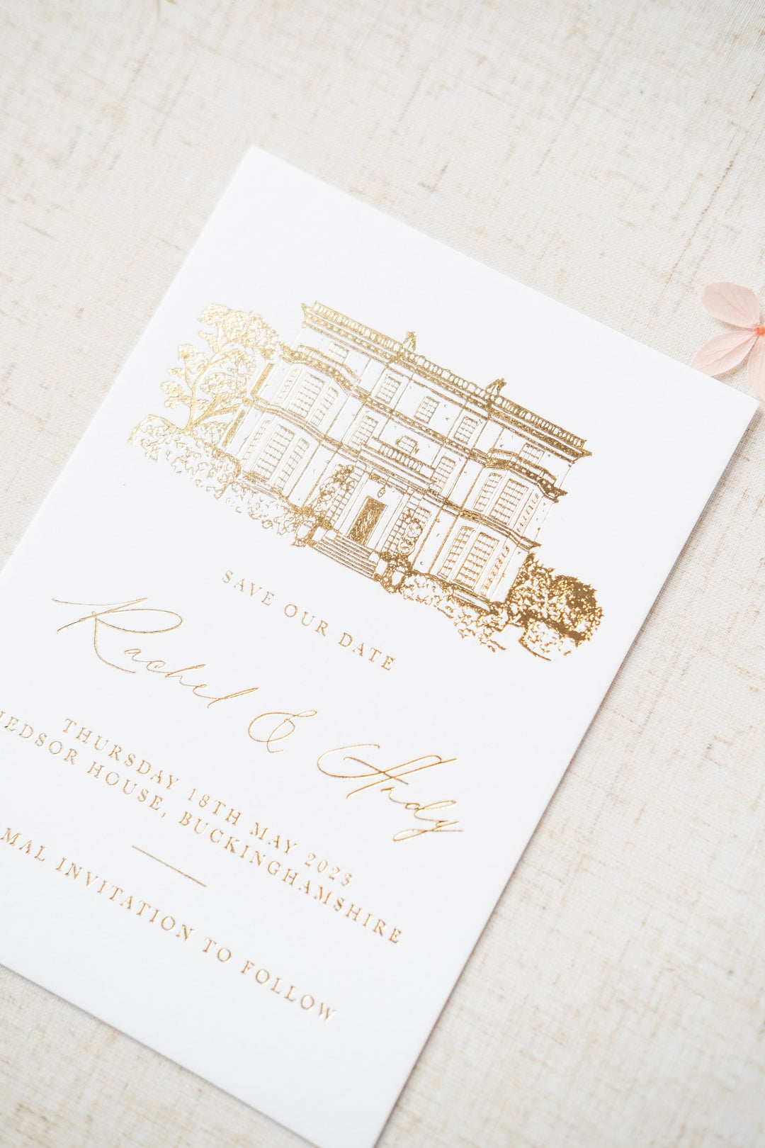 luxury gold foil invitation featuring a venue illustration