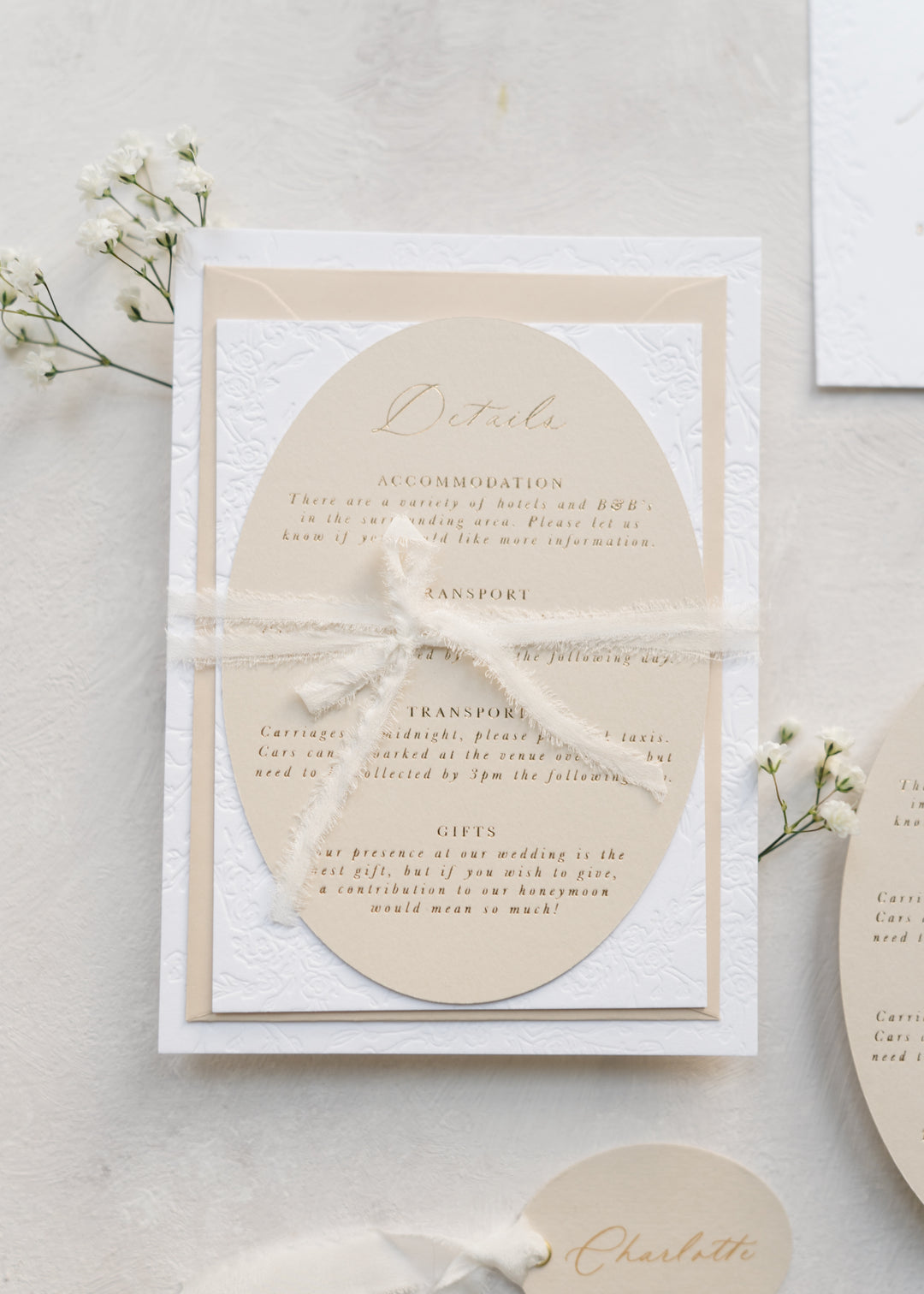 Elegant wedding invitation suite with a bow on a light background