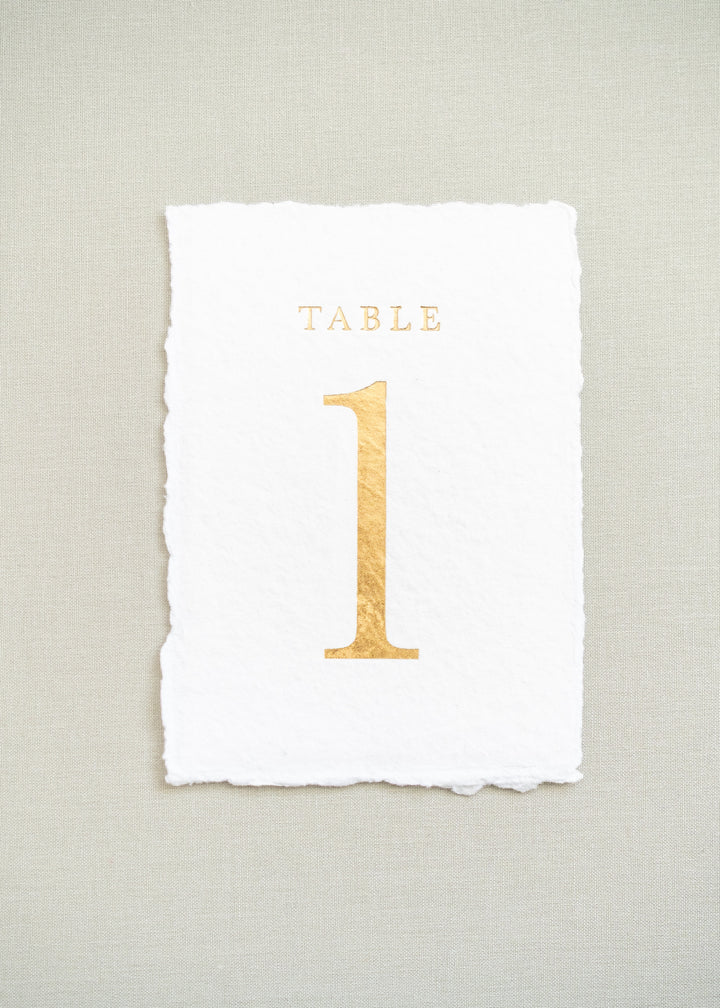 White handmade paper and gold foil table number 1