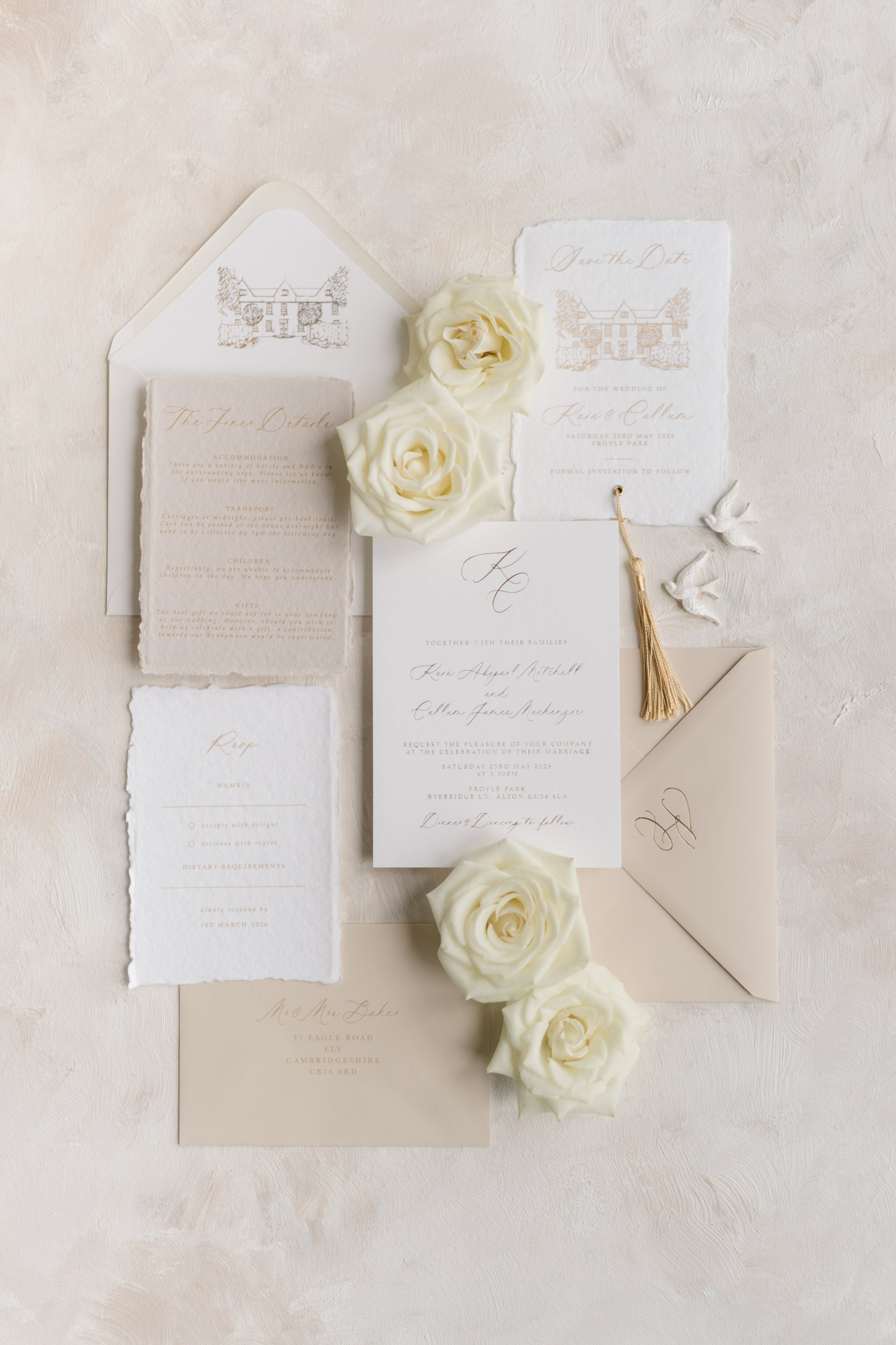 Luxury wedding invitations with gold foil and silk ribbon on ivory cardstock, elegant high-end wedding stationery