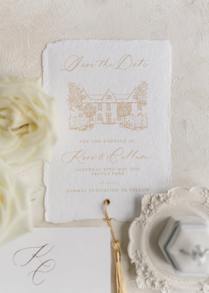 save the date card on handmade paper with tassel and wedding venue illustration