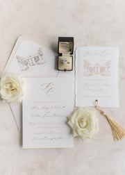 flat lay of wedding stationery featuring a venue illustration