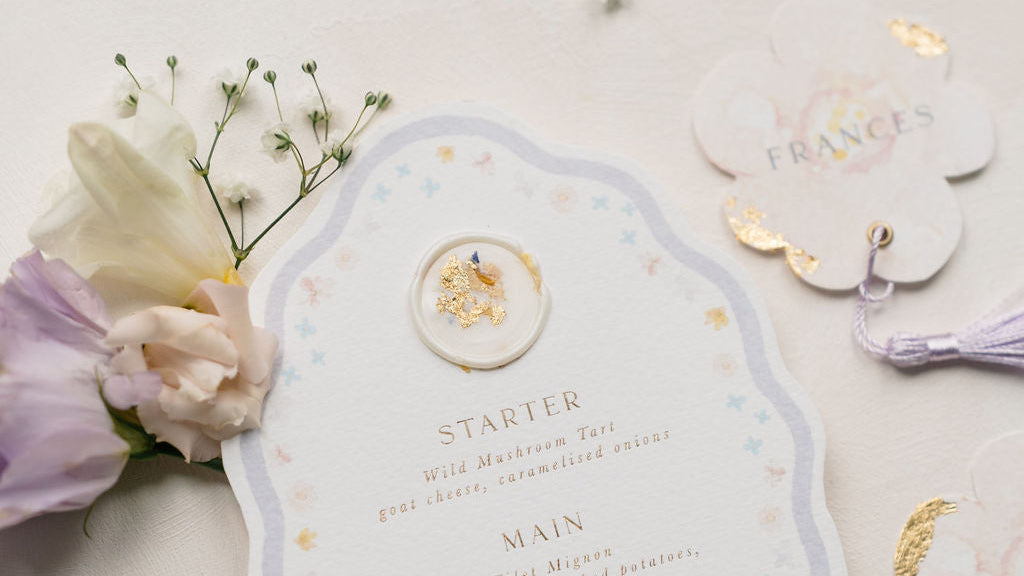 Decorative menu card with floral elements on a light background